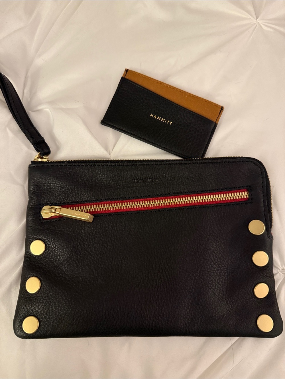 Hammitt Black Leather Wristlet with Gold Hardware and Red Zip Accent